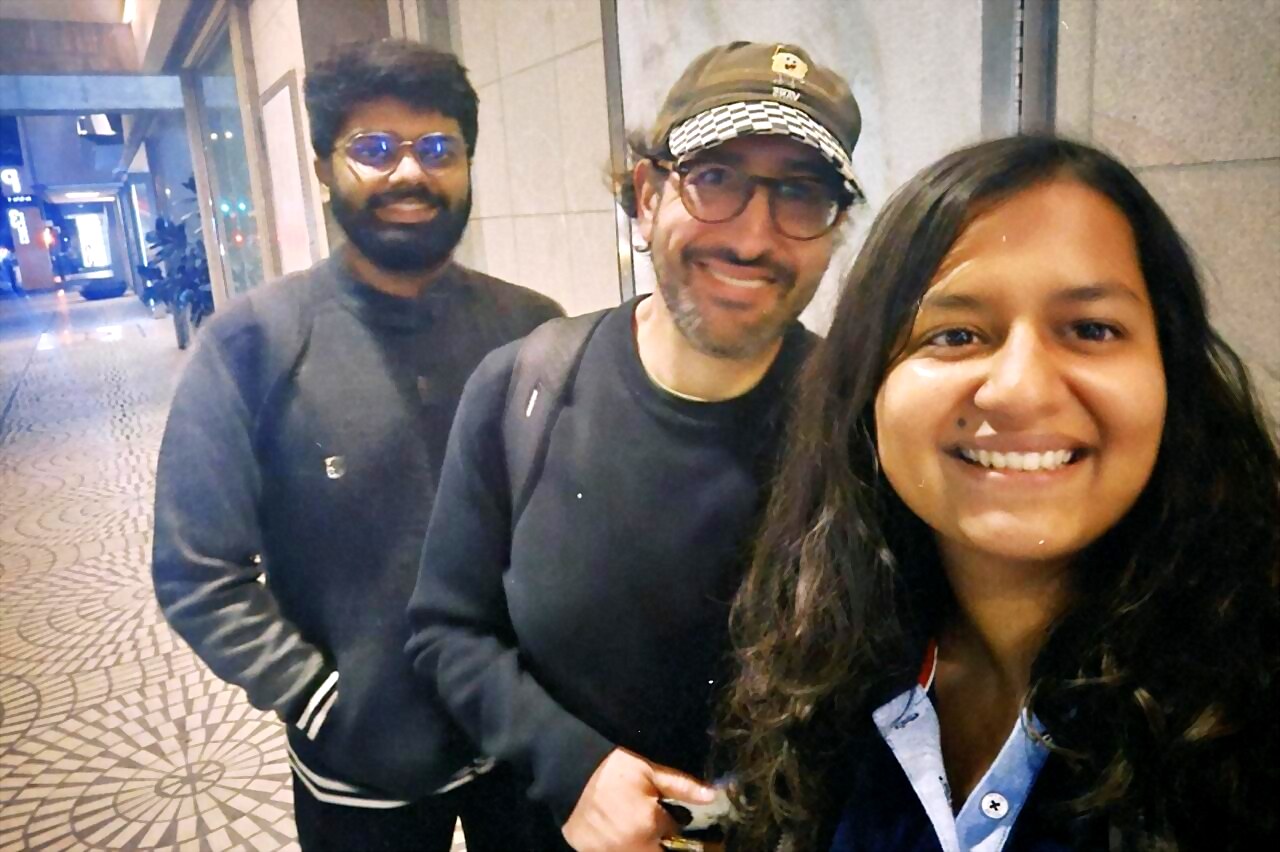 a selfie of three attendees outside after the event