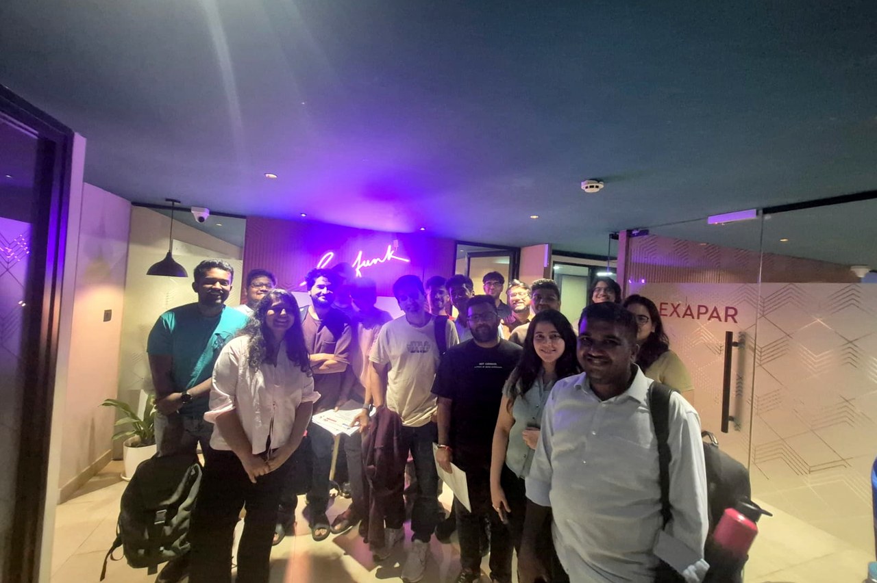 the group under the lossfunk neon before everyone headed home
