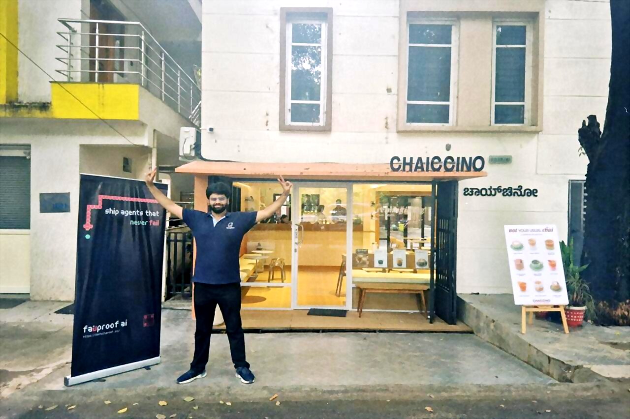 a host with arms wide outside chaiccino, next to the failproof ai banner