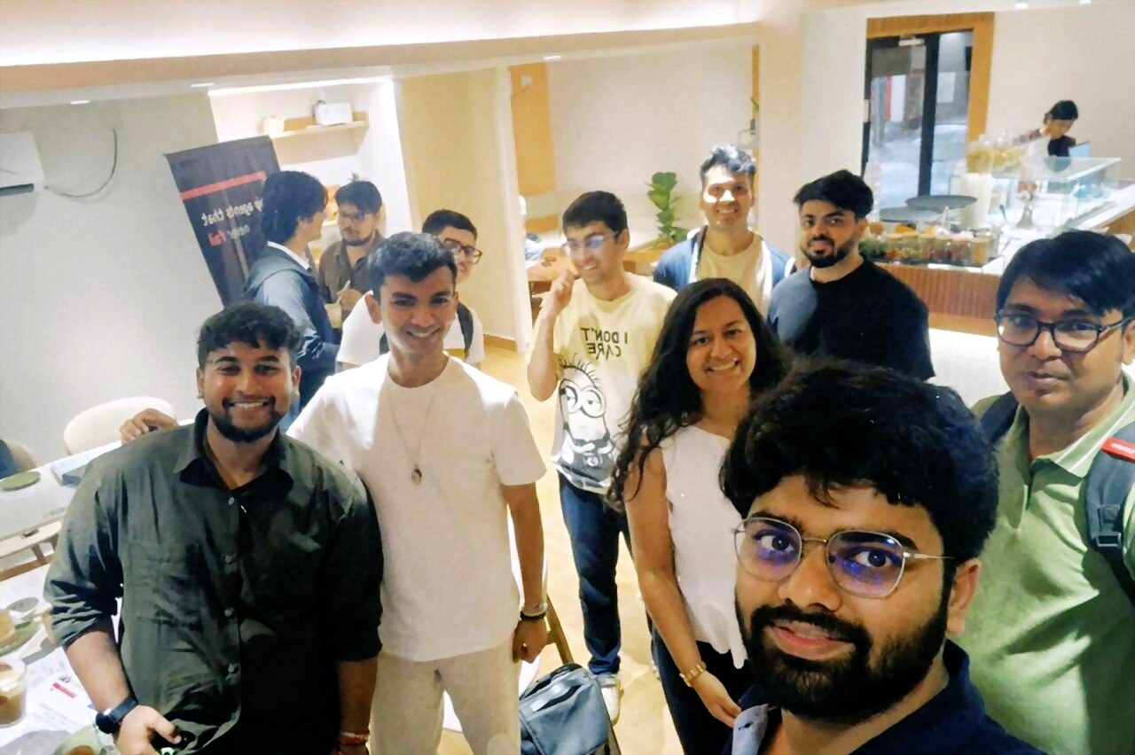 group selfie with attendees inside the cafe
