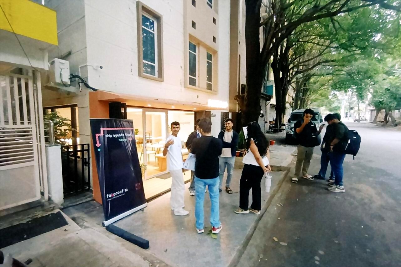 attendees chatting on the street outside the cafe